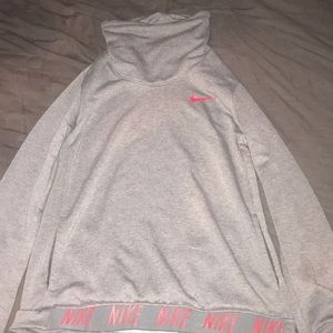 A Nike sweater with a loose funnel neck